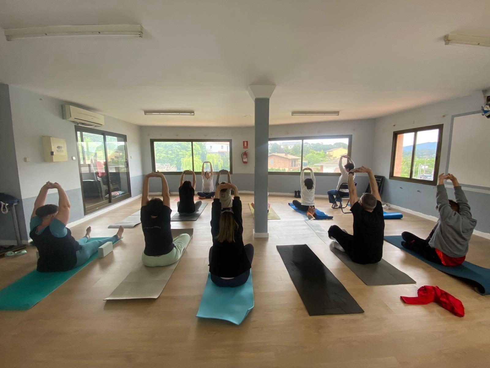 Team breathwork session in a meeting room